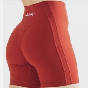 Alphalete High-Rise Bike Shorts in Deep Red